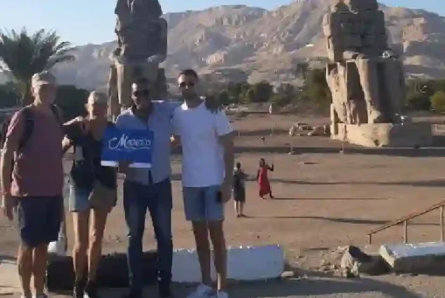 Colossi of Memnon stone statues guarded by Manolo Tours Egypt.