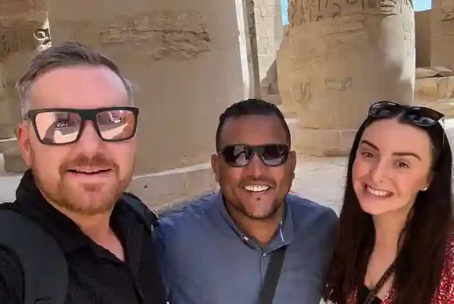 Professional Egyptologist explaining hieroglyphs in Luxor tour.